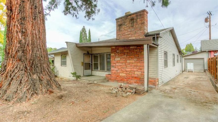 Cute home located in Old East Medford. Built in 1956 with 1329 sq ft; 3 bedrooms, 1 1/2 baths, living room with fireplace and beautiful oak hardwood flooring throughout. This charming home sits on .14 acre lot, includes fenced backyard and a detached garage. Come take a tour of this cute home before it's gone!