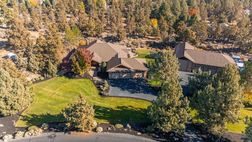 The perfect blend of small acreage tranquility and close to town convenience awaits you here in this single level Overtree Ranch estate.  With a three car garage, one primary suite and one  junior suite on opposite ends of the home, a large great room perfect for hosting, tall ceilings and doors, a 3rd bedroom with adjacent full bath and a dedicated office, this home has it all.  Beautifully landscaped grounds with an expansive paver patio and water feature surround this impressive home, and the even more impressive shop. The possible uses are endless in this space which features  a 49'x19' RV bay with a 14' tall door, three additional bays spanning nearly 1,400 square feet, bathroom and heated work room. Pine Nursery Park and all of those pickleball courts are just 1 mile from your doorstep while the up and coming east side food scene is just a little further down the road. Property has the highly coveted Avion water and natural gas. Make your way to Overtree, you won't regret it!