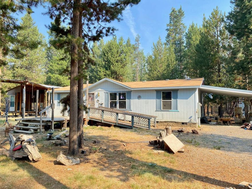 Looking for privacy, opportunity, & affordability? This one acre lot is home to a 3 bed, 2 bath manufactured home that offers all of the above as well as plenty of outdoor space for your critters & toys! Home is fully functional and awaits your personal touch. Storage Sheds, private well, septic, carport, & plenty of room for outside RV parking as well. Property is minutes to La Pine State Park, camping, world class fishing & the Deschutes River, while still being close to town. Enjoy all that Central Oregon recreation has to offer from your own parcel of privacy! Property is sold as is, all items on property to remain. Conventional or cash.