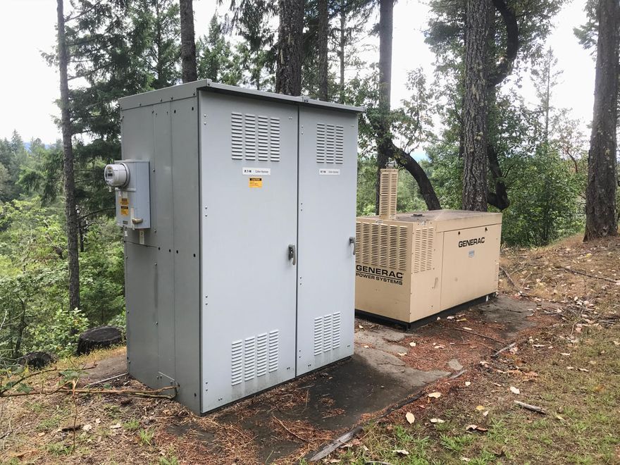 This estate consists of 2 land parcels with 2 homes bordering the Scenic Illinois River for approximately 3600 feet of riverfront that has spotted with world-class private swimming holes. The property buffered by BLM lands providing true seclusion and privacy that has become important in our ever-changing world. The custom home adorned with unforgettable custom finishings has river and mountain views from nearly every room that won't disappoint. Amenities don't stop with the seclusion this property has everything needed to survive off the land to be very self-sufficient as need. The property provides a fire suppression system, propane back up generators, varieties of fruit-bearing trees, 4000 sq foot high-end Nexus glass greenhouse with rainwater catchment, and so much more. The property is a Licensed tier 2 mixed canopy producer and has permitted to build an additional 15 cabins under a hunting lodge permit allowing you with a multitude of revenue opportunities.