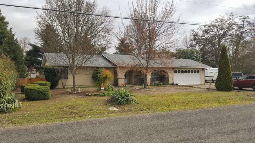 You want a home with a shop and room for an RV... Not to mention a big back yard. But everything has been priced over $300,000. Not anymore. Your new home has just hit the market, 3 bed 2 bath home with over a 1/3 acre lot with a HUGE detached shop, RV parking, and room for all your toys. You pull up to your new home and it's a well built ranch style home with a Spanish flair. You have a attached 2 car garage and room for parking in the front and side of the house. The home is comfortable and theirs room to expand and make it your dream home. Buyers have been waiting for months for a home like this, so jump in the front of the line and make it your own.
