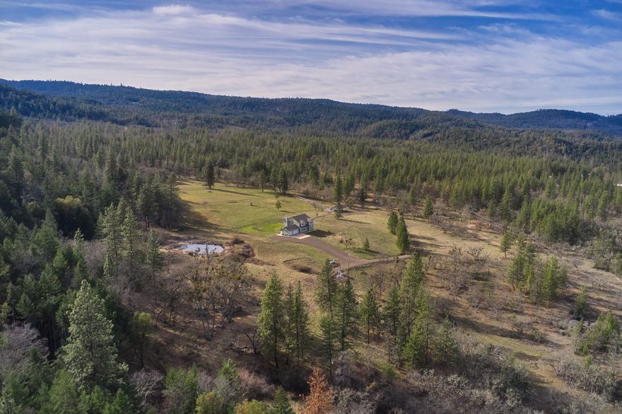 Welcome to the Allen Ranch situated in the majestic eastern foothills of the Rogue Valley in southwest Oregon. This very private ranch offers 1876+/- contiguous acres of grazing and timberland that is fenced and features a network of interior roads. The home is a 3182 sq ft custom design with 4 bedrooms and 2 1/2 baths and is tastefully appointed. The home is connected to the grid and has a back up generator system. The domestic well produces 150 GPM. Improvements include a horse barn and a cozy off-grid cabin. The horse barn has two stalls with storage. The 2 bed 1 bath cabin is nestled in the interior portion of the ranch and is served with spring fed water source and solar/generator/battery power. Deer, Elk and other game frequent the property. Views of Mt. McLoughlin and the Antelope Creek Valley are available from multiple points on the property. The drive to shopping, hospitals and the airport is just over 20 miles. The ranch is bordered by approx 1360 acres of BLM federal land.