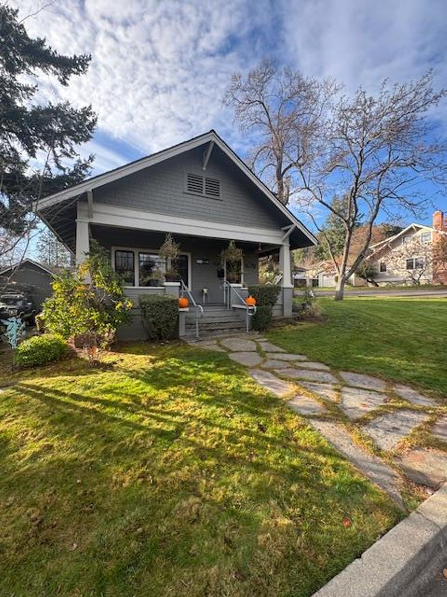 Step into timeless charm with this beautifully restored 1918 Craftsman Cottage! Thoughtfully updated in 2003, this 2-bedroom, 1-bath home blends classic character with modern comfort. Featuring 1,141 sq. ft. of living space, a 360 sq. ft. detached garage, and a partial basement for extra storage. The private, nearly quarter-acre corner lot is adorned with mature landscaping—perfect for enjoying peaceful outdoor moments. Ideally located near downtown Ashland, parks, and all city services, with an automatic attic fan for energy-efficient cooling.