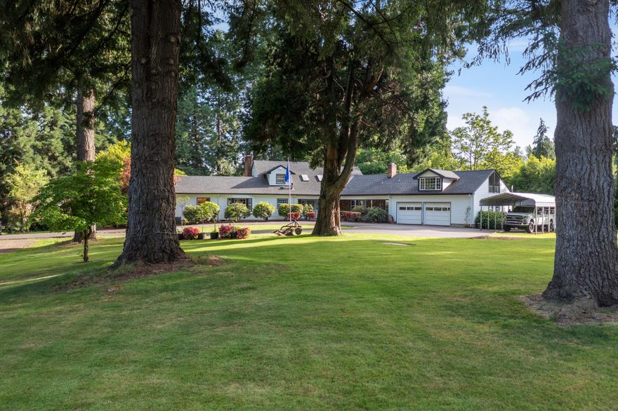 Nestled on a private gated driveway, this well built 3,730 sqft home on 3.34 acres blends luxury with serene rural living. Featuring three spacious bedrooms and four bathrooms, it boasts an expansive kitchen, cozy loft, and large windows that flood the space with light. The primary suite is a true sanctuary with a spa-like bathroom.
Enjoy sunny afternoons in the in-ground pool, surrounded by lush gardens and redwood trees. An impressive 3 Bay, 2,400 sqft shop complete with a utility sink and bathroom. With subdivision potential and convenient access to amenities, this North Albany gem is an exceptional investment opportunity!