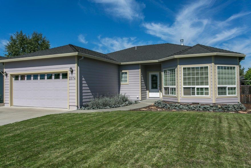 Contemporary custom home in a quiet neighborhood. 3 bedrooms, 2 bathrooms. Coffered ceiling living room with natural gas fireplace. Dining area, breakfast nook and a wonderful kitchen with stainless steel appliances. 9 foot ceilings throughout this great home. Inside utility room. Hunter Douglas window coverings. Finished double garage with automatic opener. Exposed aggregate walkways and covered patio. Relax on the no-maintenance resin-wood deck in the large fenced back yard. Fully landscaped with automatic sprinkler system. Discover this special property today!