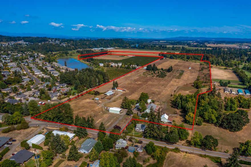 Welcome to this expansive 113 +/- acre farm that's perfect for any agricultural retail endeavor. The property features a main home, 2nd farm dwelling, 5 barns, a machine shed, hay cover, greenhouse, misc sheds and fenced pastures. This farm has some development possibilities as well. The tillable ground is covered in 88 ac of water rights sourced from on site wells. Sitting just outside the UGB, this property is full of possibilities!