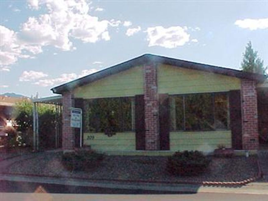 Squeaky clean double wide home in the Rogue Velley's only 5-star park. All appliances included. A wonderful place for 55+ living w/ pool, spa, sauna, clubhouse, in park shuttle; something happening any time you want to participate. Near shopping, entertainment. At home you have a nice large kitchen, open feeling living area, nice generous bedrooms- plus two patios; one covered. Best of all, seller will carry if you have good credit.