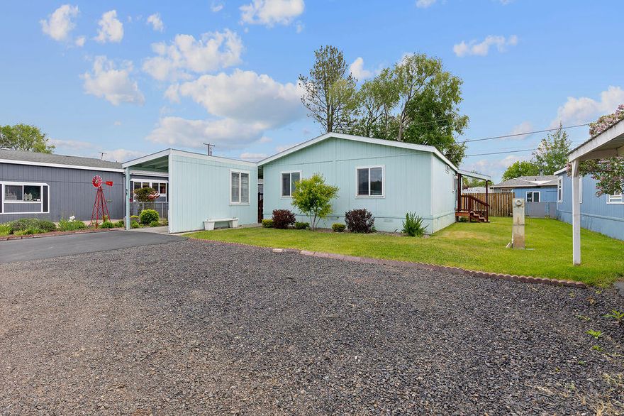 Charming 3 bed, 2 bath home located in a welcoming 55+ community features a spacious primary bedroom with walk in shower and large walk in closet. Large covered deck for relaxing and a beautiful low maintenance yard with flower beds, as well as a covered carport, extra parking and storage shed. Enjoy close proximity to amenities. RV storage is available for a $20 monthly fee. A lovely place to call home.