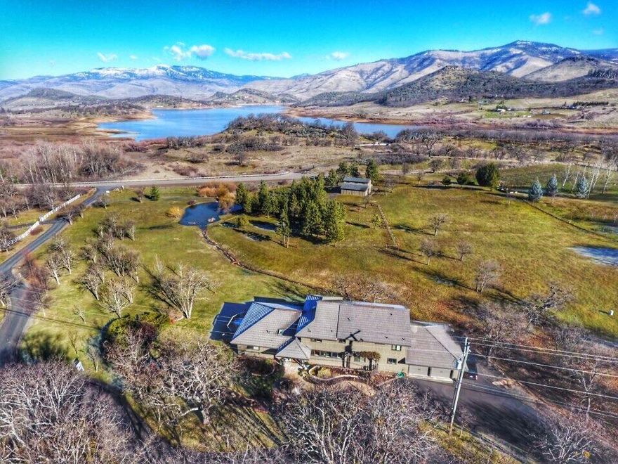 Enjoy the upscale country life style offered in this 4404 sq. ft home featuring five bedrooms, (2 master bdrms), five full private baths two with Jacuzzis, open custom kitchen with huge walk in pantry, formal dining room, lavishly appointed living room, two separate and private offices, loft/study, over sized garage & more. This 6.78 acre property also has a barn for horses with 3 stalls and room for 3 more, hay loft and 2 paddocks. There are abundant trees, TID irrigated lawn & landscaping, and views, views, views of Emigrant Lake and the surrounding Siskiyou & Cascade Mtns. All this just minutes to downtown Ashland and the Plaza!!