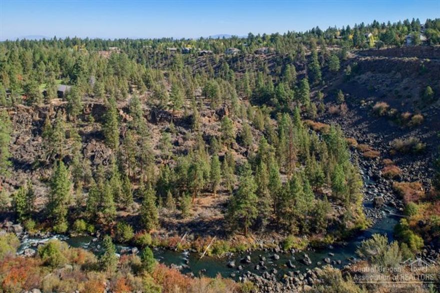 Enjoy elevated views of both the Deschutes River and mountains from this level & treed 1 1/2 acre home site on North Rim. Located on the north side of Awbrey Butte, North Rim offers the consummate high desert setting. Surrounded by 27 acres of naturally preserved land, the natural beauty of Central Oregon is visible throughout the gated community.
