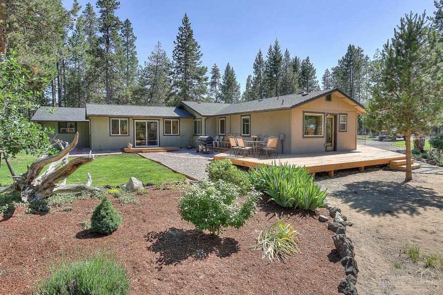 Very special one story home newly renovated on one acre backing forest (Thousand Trails). Living room/optional 3rd bedroom. New corian countertops in kitchen, stainless steel appliances, fresh paint, all the bells and whistles! New ductless heating/AC with a woodstove back up. Tile shower, soaking tub. New fencing. Beautifully landscaped. Deschutes River access/boat dock. RV friendly.