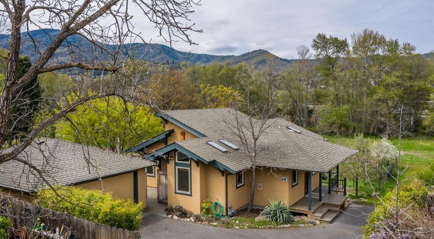 Passive solar design for this stunning contemporary home on 1.26 acres on Ashland Creek. Beautifully built in 2000 by the Shostrom Bros, premier local builders, with sleek lines & functional form. Vaulted ceilings & south facing clerestory windows create light-filled spaces that warm the stained concrete 3'' floors also warmed by radiant heat. Overhangs block summer sun & create a soft even temperature that is also quiet. Maple floor to ceiling bookcases, kitchen hutch, entertainment cabinet & fir trim & doors add to the contemporary & earthy feeling. Wonderful kitchen with granite tile counters, extra prep sink, large island, breakfast booth, dining bar & walk-in pantry with north facing window for natural cooling. Dining room opens to deck, hot tub, ornamental pond & large garden area. Main level master has large walk-in, steam shower & private view balcony. Lower level features 2 large beautiful bedrooms designed as office & art studio. 2 car-garage. Request amenity list.