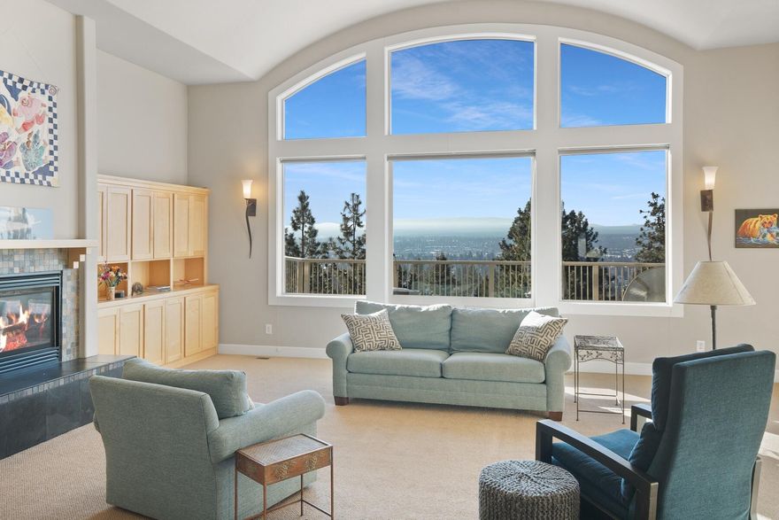 Perched on the sun-drenched side of Awbrey Butte in the coveted Hillside Park neighborhood, this residence boasts views of the iconic Old Mill smokestacks. Only a block from Hillside Park and ideally situated to take advantage of the Newport Commercial District. The main level hosts the primary suite with a highly functional layout, including the living, dining, and kitchen areas. The home features several spaces for gathering, along with ample bedrooms and an office for quieter times. The lower level includes a generous family/rec room, perfect for a media room. The recently stained deck provides an ideal viewing spot for the 4th of July fireworks launched from Pilot Butte. In the winter months, you can track the weather coming in from the west over the Cascades. The oversized windows in the living room invite you to pause and take in the beauty of the outdoors. Convenience to town, recreational activities, and amenities completes this home, blending comfort and accessibility.