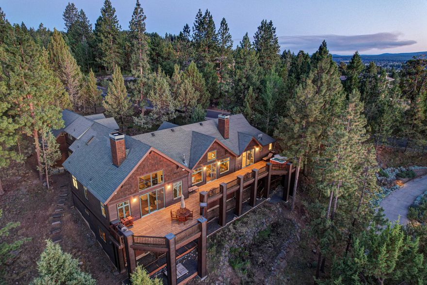 Fully remodeled 4bd/4ba, 5273 SF home with incredible updates and spectacular sweeping views of the Cascade Mtns, located in one of The Most Desirable Neighborhoods in Bend, AWBREY BUTTE! This home features fabulous high vaulted wood ceilings and gorgeous hand carved/distressed wide-plank solid hardwood flooring with three sets of oversized sliding glass doors that run the length of the home - all overlooking a beautiful 1000 plus SF Cedar Deck. Designed with an extremely spacious & well thought out floor plan, the home offers nice separation of living quarters. The oversized main level Primary bedroom and en-suite bath are highlighted by a new steam shower and radiant heat floor. Work from home comfortably in the large upper level library/office area. You're also going to love the newly added 756 SF lower level Bonus/Rec Room, 3 car epoxy coated garage with additional storage room, and an extra 854 SF of workshop/storage space on the lower level.