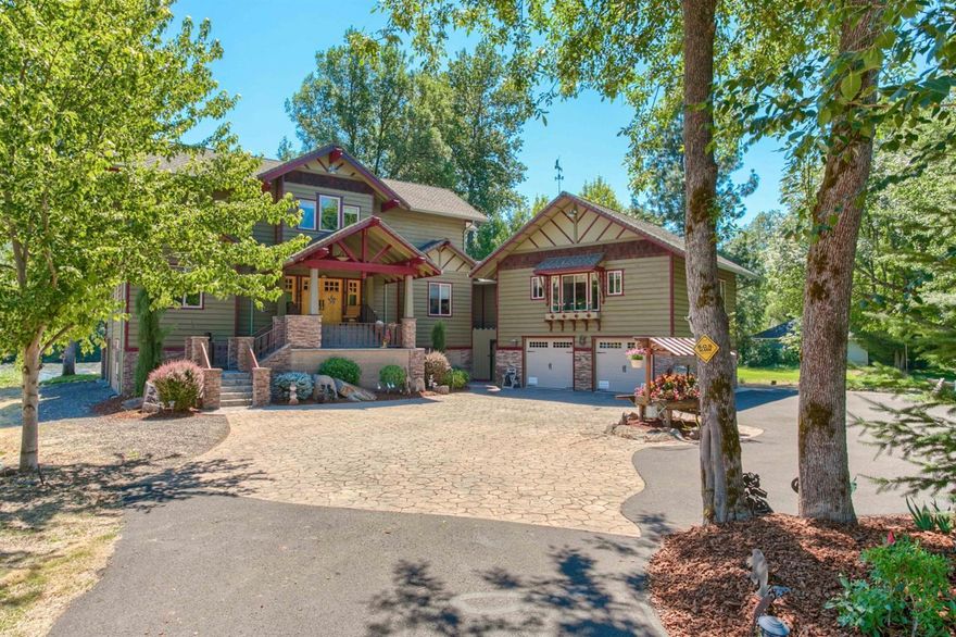 This is a beautiful, custom built, craftsman style home that sits along the Rogue River. If you have ever wanted to live the peaceful life that riverfront living can bring, then this is it! This fabulous home features 4 bedrooms, 4 baths & 3716 sq. ft of living space. The great room is stunning with its high ceilings, beautiful rock fireplace & gorgeous views of the river. The kitchen features granite, custom cabinetry, high quality stainless appliance & lots of storage. The wood floors are beautiful. Master suite is on the main living floor. Also there is a guest wing with kitchen, bath & bedroom. Upstairs are 2 bedrooms, each with their own baths, a family room, an office and more storage. 2 car attached garage on the ground floor along with basement parking for up to 8 cars & lots of storage space. The outdoors is beautifully landscaped. Fenced garden, large upper deck w/river view & access to the river for fishing. There is even room to install an Elevator in the future!