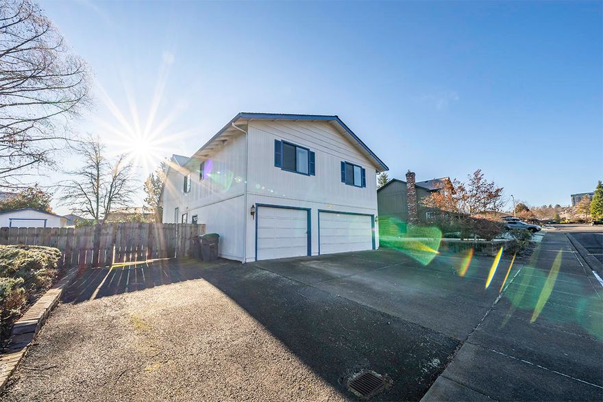 Looking for an excellent neighborhood in E Medford? This 4 bedroom, 3 bath 2490 SF home on .24 acre lot has so much to offer! Formal living, dining off the large open entry. Kitchen opens to eating area and vaulted family room. There is a full bath and bedroom downstairs. 3 more bedrooms upstairs (master is upstairs) with 2 full baths. There is a loft open to the family room for office, play  area, you decide. There is a 3 car garage and a double gate with huge RV gated parking! Large covered deck off the kitchen and lots of space for the family. Call or text for your private showing! Priced to sell! One year Fidelity National Home Warranty included.