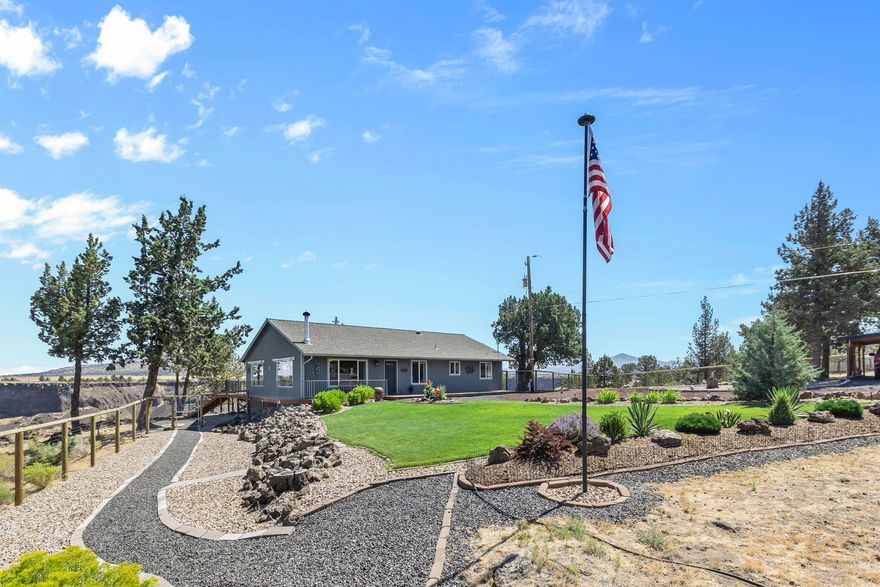Unrivaled views from the tip of a peninsula on the Canyon Rim! Enjoy breathtaking 180+ degree vistas of the Cascade Mountains, Crooked River, canyon, & valley from nearly every room of this thoughtfully designed home. Large picture windows & a vaulted great room floorplan maximize the beauty & abundance of natural light throughout. Newer features include new wood look flooring, appliances, woodstove & hearth, fence, & a solar gate opener. A spacious kitchen w/plenty of counter prep space, a breakfast bar island, warm cabinetry, & step-in pantry. Generous primary suite w/walk-in closet, plus two additional guest rooms adorn this single level home. Relax on the expansive Trex deck or explore nearby trails. Detached 24x24 garage/shop w/concrete floors, 20x20 horse shelter (or extra parking), & RV space offer room for all your toys. Just blocks from the fire station & minutes from all the amenities Crooked River Ranch has to offer.