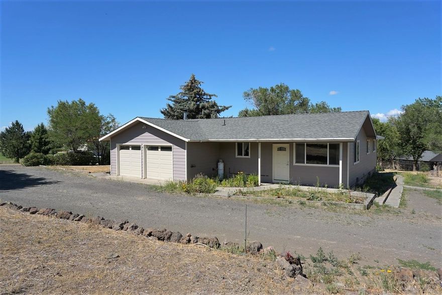Nearly a full acre with water rights ready for your family and animals. Private setting. Don't miss this opportunity.