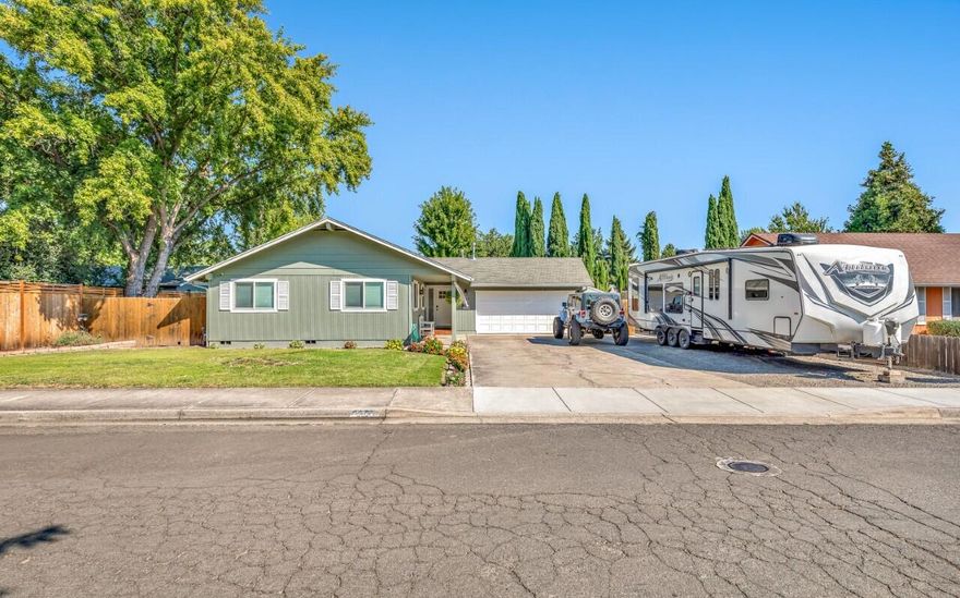 Back on the market- no fault of property! Recent inspections, and VA appraisal at value. Assumable VA loan @ 3% Call LA for details. A true 4 bedroom 3 bathroom home in SW Medford with extensive RV parking & FULL hookups! This home has been immaculately taken care of, and has recently been completely remodeled with no expense spared. Vaulted ceilings, LVP flooring, new windows, doors/hardware, sliders, garage door, updated bathrooms, and much more! The kitchen alone is brand new with custom cabinets (soft close drawers), quartz countertops, two skylights, and all new appliances staying with the home as well as all of the flat screen TVs!! Updated electrical, plumbing, and a brand new HVAC system/ducting. Sizeable front & backyard with outdoor sprinkler system, garden beds, oversized shed, and new fencing on the West side of the home. On a quiet street, and lots of parking, this home brings immense value and is ready for its new owners!