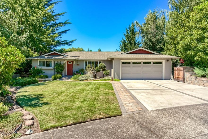 Fantastic 3 bedroom, 2 bath, 1981 sq ft home on a large .27 acre lot features a step down living room, with window seat and top down-bottom up blinds. The updated kitchen has new granite countertops and backsplash, 2 skylights, Koehler sinks & lots of counter space, pantry, open to eating nook/family room, floor to ceiling rock surround with certified wood stove, formal dining room with glass shelves & vaulted ceilings. French doors off kitchen & dining rooms to deck. Nice master suite & updated bath with tile floors, pedestal sink & shower with tile surround. Laminate, carpet and tile flooring. Beautiful solid core doors, vinyl windows, all new lighting & lighted mirrored hall closet. Spacious deck to a large yard, under house full standup storage with shelves & built in work benches. The beautiful yard is a gardener's paradise with fruit trees and seasonal flowers. Many updates to include newer roof & gutters, garage door, water heater & heat compressor. Close to Hoover Elementary.