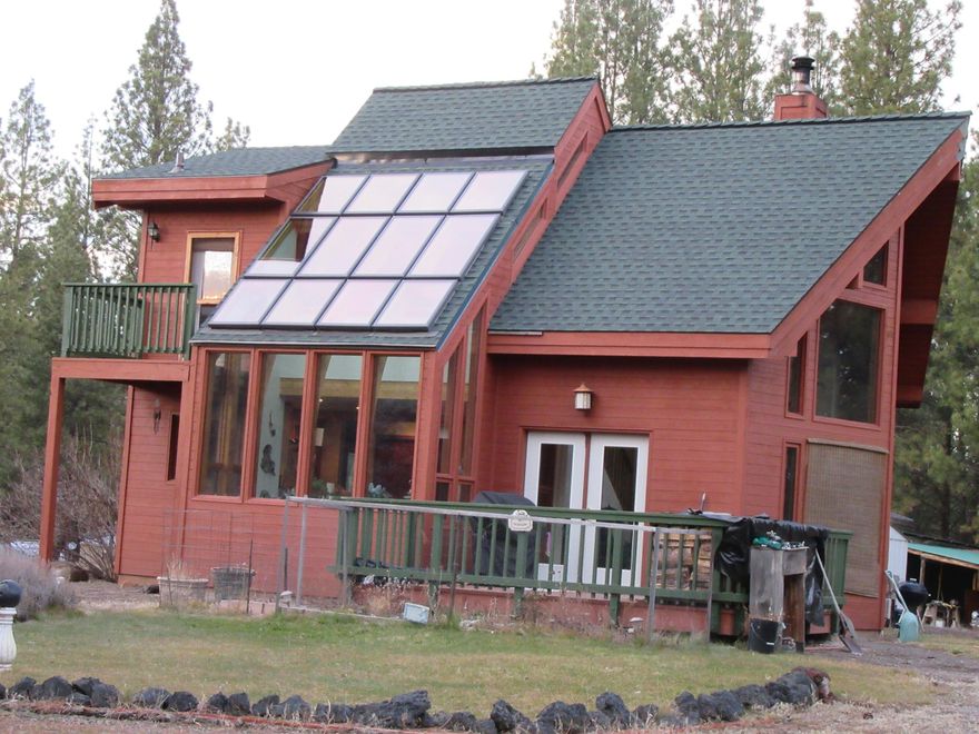 Gorgeous 2 story Lindal Cedar Home on 10.13 acres. 2 bedrooms 2 full bathrooms. Lots of high-end finishes throughout home! Upstairs Primary Suite has Large Jetted soaker tub & walk-in closet, separate shower, double sink vanity with Marble. Commercial grade greenhouse covered atrium with table and seating all the way around, Regency high-end top of the line Wood Stove Fireplace insert. Windows trimmed with Wine-Soaked Redwood, Circular drive-in front of home. Carport, 2 car garage /shop, other shed /work areas outside. Private entrance with long driveway. Hard to see home from road.