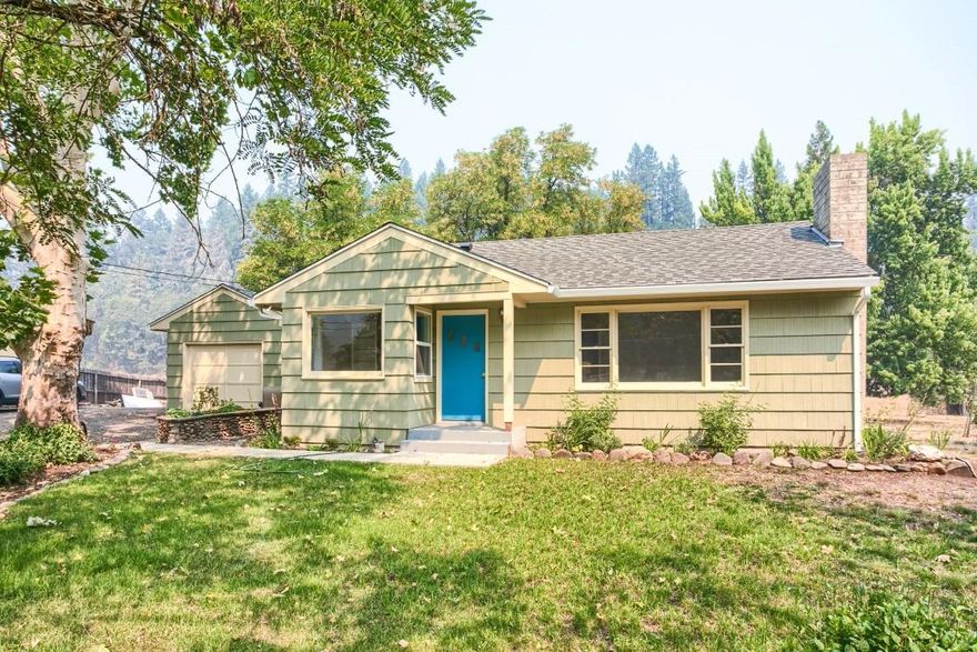 Adorable and a Great Value! This two bedroom, one bath home has been completely redone from the inside out and it's move in ready. It is a light and bright floorplan with a great backyard on a .43 acre lot. The updates to the home in 2017 include: new wood floors, new roof, new granite in the kitchen, new tile floors in the bath, new quartz counter in the bath, all new subway tile surround in the shower, new deck and all new paint inside and outside. The one car garage had a garage conversion and is now a great multipurpose room with the laundry inside. It's such a great home and a super investment opportunity. Just across the street from the Rogue River where you can find great world class fishing and rafting fun in the summer.