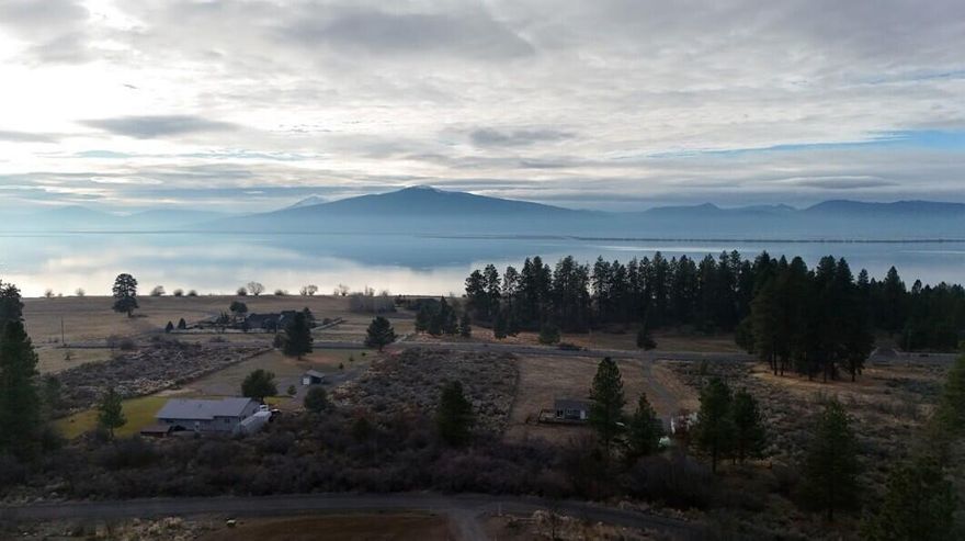 SPECIAL SUMMER PRICE! $28,900 till Labor Day! LAKEVIEW PROPERTY! Land lot with Agency Lake and Mountain views 0.43 of an acre on a quite cul-de-sac. Enjoy the beautiful sunsets, wildlife and mountains! The water IS on the property and the power hook up box is about 50 yards from the property boundary. Septic IS installed. 2/3's of the property is fenced with quality fencing. All the hard work is done for you come build your dream home and own your own little slice of heaven. Need Financing!? I have lender contacts that are lending on land lots!