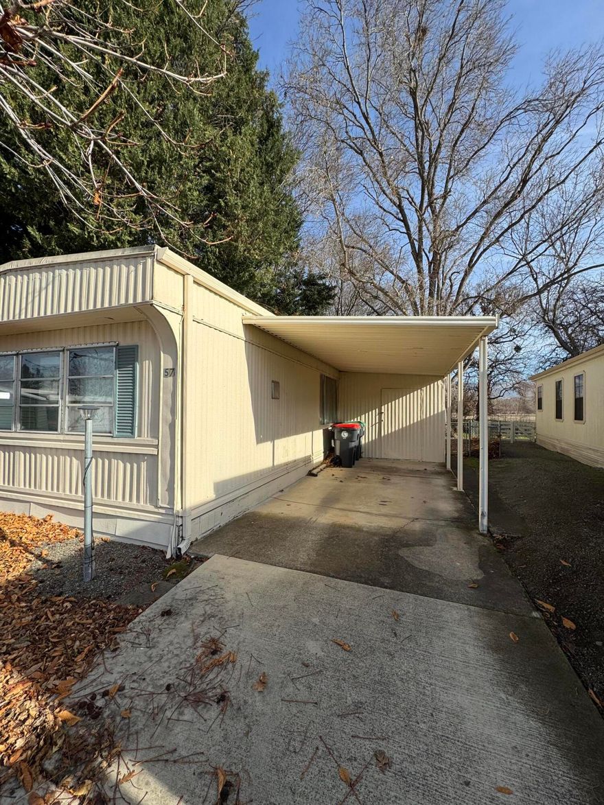 Great little single level home in a desirable park. This home is turn key and ready to move in with new carpets and very clean. There are 2 sheds for storage on the property with a completely fenced yard for pets! Located in the back of the park this home feels like its off the beaten path! Close to Bear Creek greenway for walking or biking! Behind this home is an open space with trees and wildlife!  The club house and pool are nice amenities this will make a great community to liver in! Come tour today!