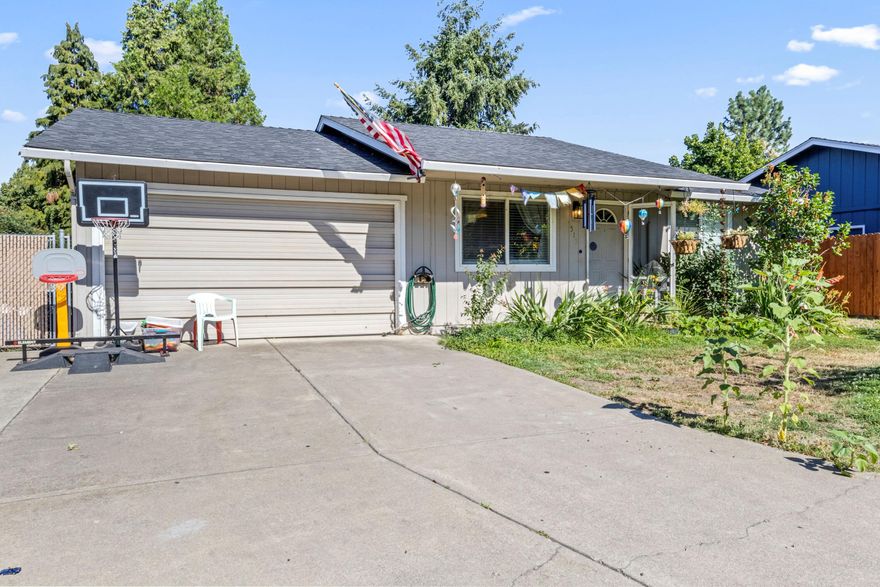 Great starter home! This charming and cozy 3-bedroom home is located in a nice Talent neighborhood, conveniently close to parks, schools, and shopping centers. It features an attached garage and plenty of driveway and on street parking. Inside you'll find an abundance of natural light in the kitchen and dining area, thanks to a lovely, large sliding glass door that not only brightens the room, but opens up to a patio in the fenced backyard. There is plenty of outdoor space to relax or entertain! The home has been lovingly cared for. Call for a tour today!