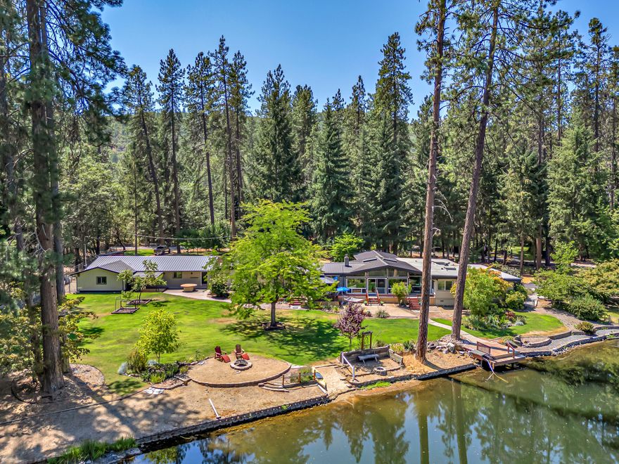 Located in the Gold Rey Estates Subdivision (only 10 mins from town), this 3200+ sq ft single level estate borders a private lake (350+ ft of lake frontage) that features 5 bedrms, 4.5 bathrms, 1.51 level acre lot w/ water rights, open floor plan, chef's kitchen (granite countertops, large island, custom Hawaiian Koa cabinetry w/ built-in pull-outs, tile flooring, large pantry w/ rotating shelving), vaulted ceilings, attached guest quarters (separate entrance way, full bathrm, bedrm, vaulted ceilings), detached 3 car garage, circular asphalted driveway, large deck, attached carport, & full RV hook ups! Owner spared no expense towards remodeling the entire primary bathroom w/ a spacious tiled walk-in shower, 3 sinks, & walk-in closet, installing metal roofs on the house, detached garage, & workshop, & enhancing the landscape. Seller is offering a one-year home warranty with an acceptable offer!