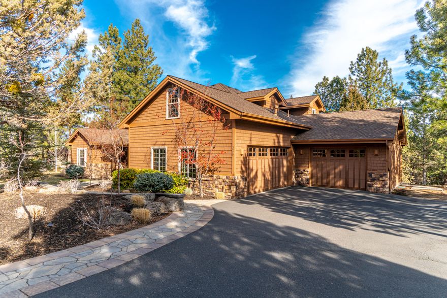 Experience the NW Bend lifestyle from this fantastic location in sought-after Awbrey Glen! Thoughtfully designed and situated on a private .43/AC corner lot overlooking the 12th tee, this home offers Main Level Living and quality craftsmanship. Spacious cook's kitchen features concrete countertops, prof'l grade stainless appl, and fabulous separate bar w/direct access to the back deck blending indoor/outdoor living seamlessly. Light-filled Great Room w/dramatic stone fireplace, soaring ceilings and delightful formal Dining Rm. Main level Primary Suite w/access to hot tub deck, separate vanities, soaking tub and tiled shower. Additionally on Main Level: Private en suite w/steam shower. Upstairs: 3 generously-sized BR and remodeled full BA. Expansive back deck is truly an entertainer's dream space offering a charming covered area for al fresco dining, built-in grill, Quartz countertops, stone accents and gas fire table. Moments to tennis, golf, trails and all Westside amenities.