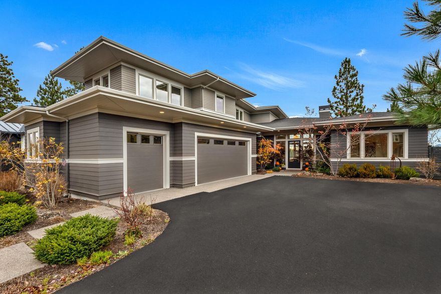 Located on a ridge above Discovery Park, this COBA Tour of Homes award winner has beautiful indoor & outdoor spaces for enjoying views of Discovery Lake, and territorial views to the east & south of Bend. Visitors are welcomed by a glass entryway framing views from the great room, with a wall of windows, hardwood floors, built-ins & a rock fireplace. The designer kitchen features large center island, custom cabinetry, quartz counters, exceptional appliances & a walk-in pantry, & is open to a dining area with additional banquette seating & access to spacious covered & open patios. The main-level primary suite has lake views, a tiled shower, soaking tub & walk-in closet, and there is a private office adjacent. Upstairs, there are two additional bedrooms & a large bonus room with views. A 3-car garage with epoxy coated floor & a mudroom with built-ins offer spaces for staging outdoor adventures from this ridge-top home convenient to local restaurants, shops, schools, parks and trails.