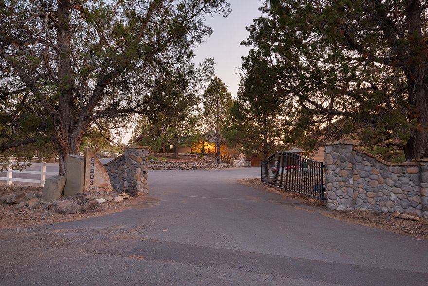 Exceptional Spacious Equestrian Estate on 5 Acres centrally located in close proximity to Tumalo, Sisters, and Redmond. This property offers country tranquility with city amenities, 5 minutes to a shopping center, 10 minutes to downtown Bend, and only 15 minutes to the Redmond airport. Cathedral ceilings and large windows offer views of the Cascade Mountains in a secluded setting. 6 Bedrooms, 4 Baths with 2 laundry rooms, offering a luxurious primary bedroom and bath with a stunning river rock fireplace, balcony, hot tub, steam shower and his & her closets. 4 acres in-ground irrigation and fenced. 3200 SF shop w/large office, 1/2 bath (easily upgraded to an ADU). Gourmet kitchen w/granite counters, travertine w/stainless steel appliances. RV parking w/full hookups & dump. 24'X 36' barn w/loft. Newer deck, railing, and Tile roof with no HOA. It is truly a one-of-a-kind property and must-see.