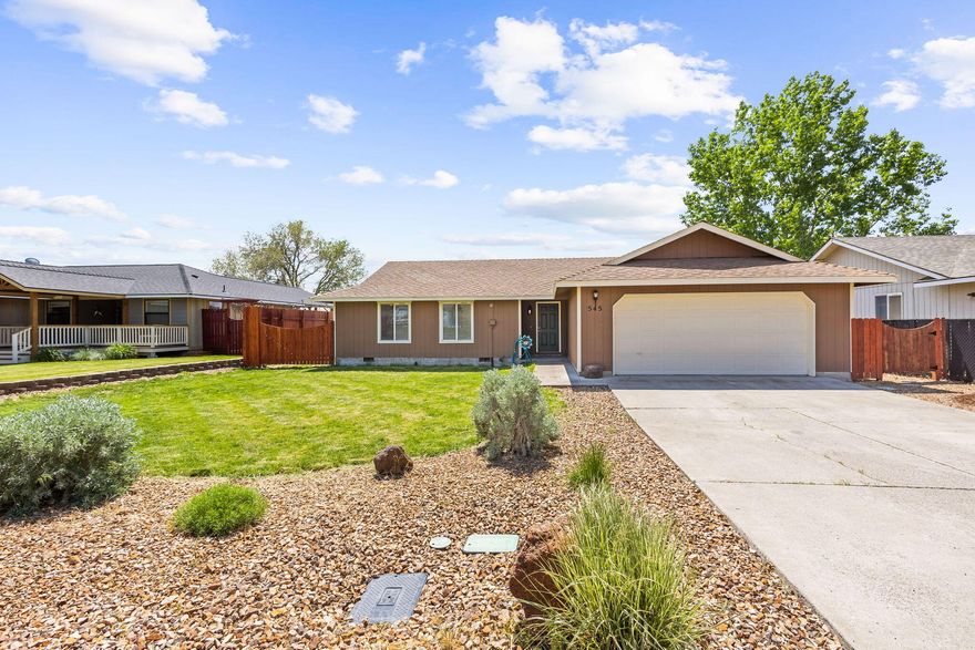 This property offers the rare combination of spacious living and convenient proximity. Introducing 545 SE Grizzly Road in Madras Oregon - your opportunity to call this address home sweet home! Experience the best of both worlds with the tranquility of a generous .33 of an acre lot while still being within easy reach to city amenities. Enjoy the luxury of ample outdoor space, large deck & parking options as well as 4th of July fireworks from your back yard! Interior features include the elegance of vaulted ceilings that create an airy and spacious ambiance.  This home has been graced with new laminate wood flooring, Updated bathroom vanities, walk-in tile shower, and kitchen that was remodeled in the recent years.  Fully finished garage with attic storage, storage closet and work bench/shelving. Large picture windows offer lots of natural lighting.  Call your preferred Realtor today for your personal tour.