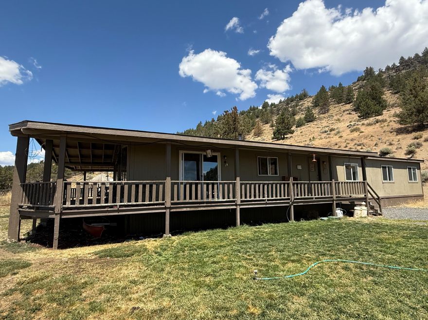 Irrigation well with permitted water rights! Beautiful views of Mount Shasta! 2 homes! Those are just a few of the benefits of this property. This property has just under 400 acres, 128.5 of those acres are irrigated with a 1400 gallon per minute well. The lower property has produced 6 ton per acre of alfalfa hay and the upper has produced 7 tons per acre of alfalfa hay. Property originally produced seed potatoes. Main home is a 3/2 MH with an office, two separate large living areas, laundry room with utility sink and room for a fridge or freezer, A/C, F/A furnace, vaulted ceilings, large front windows and a wrap around porch with views of Mount Shasta, and a certified woodstove to keep you cozy in the winter. Property has a detached 2 car garage w/concrete floor, power, extra insulation and workbench. There is a greenhouse, raised beds, apple, peach and apricot trees, fenced garden area, animal stalls, chicken house and small hay barn. 2nd home needs work. Property sold ''As Is'.