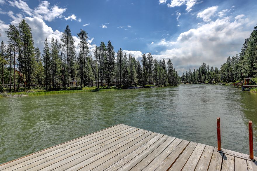 Welcome to your riverside paradise on the Deschutes River! This exquisite 1,959 sqft home has been thoughtfully renovated and offers 3 beds, 3 baths, and a private dock. Surrounded by majestic old growth pine trees, you'll enjoy approximately 110' of river frontage and a large backyard with unlimited options to relax or recreate. With multiple spots to tie off and a  boat slip, you can explore and enjoy over 20 miles of the beautiful Deschutes scenic waterways right from your own backyard. Embrace the allure of riverside living in this exceptional oasis, where tranquility and adventure await.