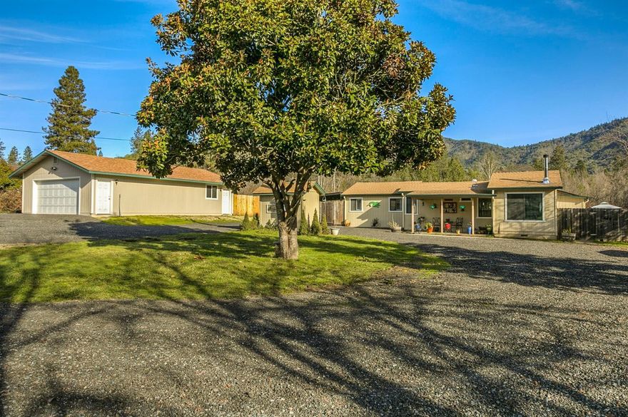 Cute as a button and updated too! This 50's home sits on .58 acre lot and features a new garage/shop and mountain view. Most of the home was updated from 2014-2016 with beautiful laminate flooring, gorgeous hickory cabinets, SS appliances and granite counter tops in the kitchen, lovely new master bedroom & master bath, new certified wood stove to keep the home cozy and an open floor plan. The new garage/shop, 24' x 40'fits 4 cars and is an added bonus for your vehicles, hobbies or toys! The backyard is an entertaining oasis with a covered patio, fire pit area, mountain views and above ground pool! There is even a garden area with raised beds. There is so much here for the price! Is THIS your new home?