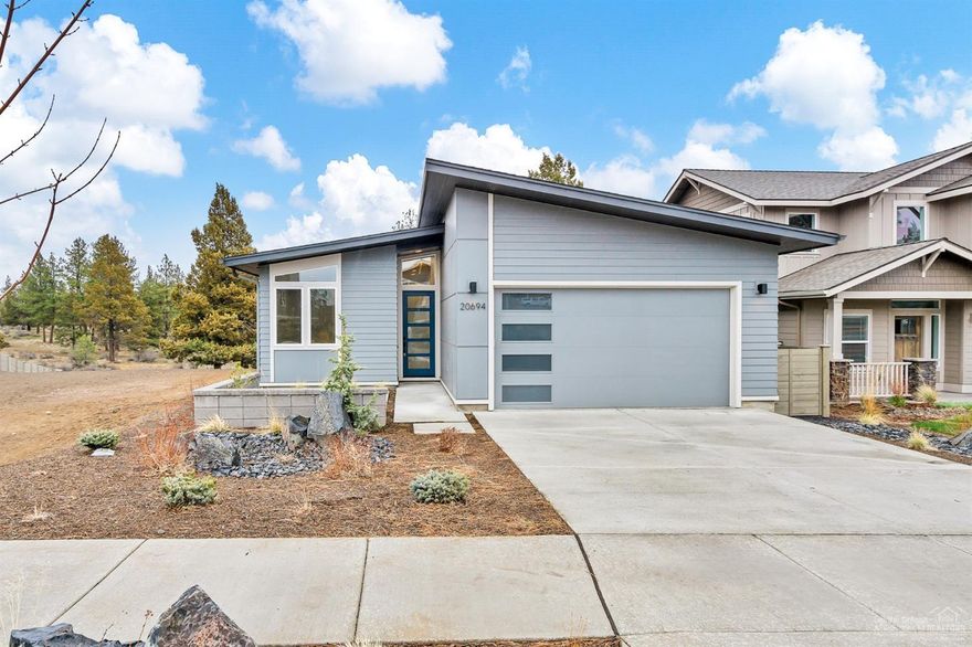 This single level contemporary style home with 3 bed and 2 bath, built by Salvesen Homes, is a must see! Situated in desirable Hidden Hills one lot over from the future footpath to upcoming Alpenglow Park, you'll love the convenience to nearby amenities and recreation. Wood floors run through the open great room and well appointed kitchen, which includes solid surface countertops and stainless steel appliances. Master suite boasts spa like tiled shower, solid surface countertops and double vanity. From the covered patio and outdoor space in the backyard, enjoy the views of open, native landscape.