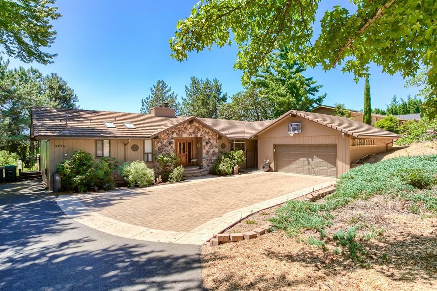 Appealing East Medford home in fantastic neighborhood on huge .46 acre lot! Charming rock covered front porch and curved brick steps to entry. Expansive deck overlooking back yard. Beautifully updated kitchen features stainless steel appliances and raised eating bar open to dining room. Attractive wood flooring throughout main level. Vaulted living room with wood ceiling & beam accents, large picture windows & stone fireplace with raised hearth. Family room with brick fireplace & woodstove insert - large bookshelf included. Spacious, main level master suite has slider to deck, walk-in closet, double sink vanity, jetted tub & separate shower. Guest bedrooms and extra family room with wet bar & built-in media cabinet leading to media closet on lower level. Great storage too! Laundry room has sink, folding counter & extra cabinet storage. Lower level is plumbed for 2nd laundry hook-ups. 2 car garage attached via short breezeway. RV parking.