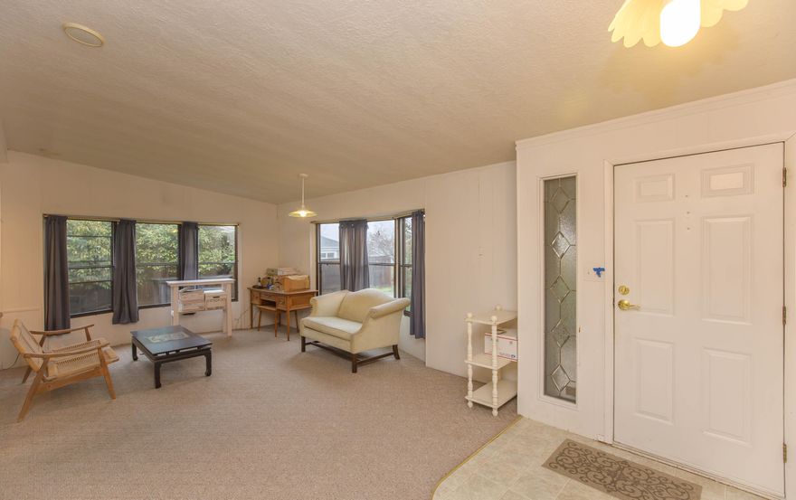 Tucked into a quiet corner of Tolman Creek Park, this light-filled 2 bedroom, 1.5-bath-manufactured home offers a rare blend of privacy & connection. The spacious living & dining area spans the entire front of the home, welcoming you with abundant natural light & an easy, open flow for everyday living or entertaining. Out back, enjoy peaceful views backing to the YMCA soccer field, serene & open, yet far from feeling isolated. Cozy up by the wood stove on cooler days or step into the screened-in back porch complete with a sink, an ideal space for a craft room, workshop, or creative retreat. Multiple storage sheds add valuable functionality, while the park itself features a lovely grassy open space, perfect for casual community get-togethers or chatting with neighbors as you pick up your mail. Guest parking is conveniently located just across the street from the driveway. Comfortable, welcoming, & well-situated, this home offers a wonderful balance of quiet living & friendly community.