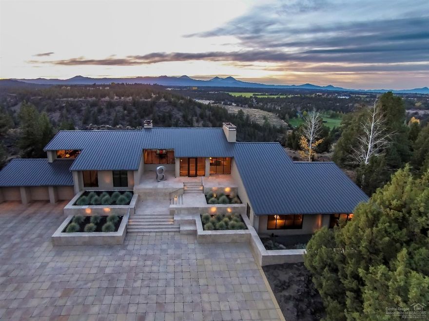 Gated estate with two tax lots. Each property is 17 plus acres with irrigation rights, unobstructed Cascade Mountain views, high bank Deschutes river frontage, impeccable landscaping and ponds. One of the properties hosts a beautiful Neal Huston Design home featuring 3 beds, 3 baths with over 4,900 sq ft of living space. There are endless opportunities for the vacant lot; it could be left untouched, built on or resold if you're looking for an investment property. Minutes from downtown Bend.