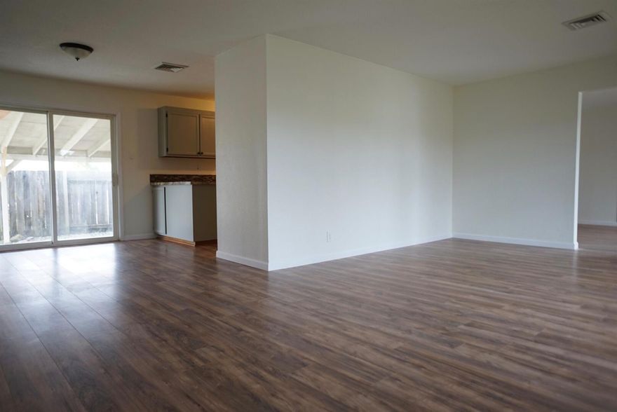 This move-in ready home has been recently updated with all new laminate floors, vinyl windows, remodeled kitchen, new roof, and new HVAC system! Also features a 1 car attached garage, covered back patio,natural gas oven, and a large bonus room that could easily be converted into a 4th bedroom.