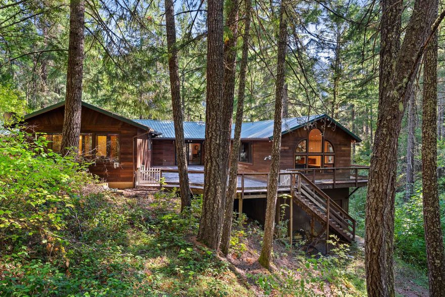 Secluded & wooded 18 acre retreat. Would make a great horse property bordering over 3000 acres of BLM land. Custom built 3 bedroom, 3 full bath & 2589 SF. Large bonus room could be used as a 4th bedroom. Built-in cabinetry throughout. Central heat with propane plus 3 pellet stoves. Central vacuum system & built-in speakers throughout. Lower level has a pantry, mechanical room, 2 car garage & large workshop w/220. Wrap-around deck to enjoy your own private forest. 675 SF, 1 bedroom, 1 bath detached guest home. Metal roofs. 2 wells & 3 holding tanks. New well pump in 2023. Seasonal creek. Plenty of room for RV/boat parking. Just a few miles to Galesville Reservoir for access to boating & fishing. 10 miles to I-5 access. AW zoning (Agriculture & Woodlot). Shown by appointment only. Virtual tour and floorplans available.