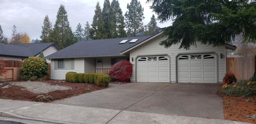 A Beautiful home in established North West neighborhood of Grants Pass with District 7 schools awaits you. Nicely laid out 1673 sq. ft. of open floor plan, 3 bedrooms, 2 baths, inside laundry and lots of storage throughout the home, with attached 2 car garage on .20 of an acre. Enjoy natural light from all the windows, sky lights and kitchen garden window. Kitchen has plenty of cabinetry and breakfast bar that is open to the dining room with built in wine glass cupboard. Primary has en suite, walk in closet as well as separate spa room with double doors that leads to back deck. Well kept and all original. 
All information deemed reliable but not guaranteed, Buyer to do own due diligence.