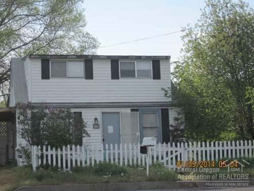 This little home in SW Madras has some great updates! 2 bedrooms on 2nd floor have new carpet and the 2nd floor bathroom has been updated. Main level has living room with new carpet, kitchen and bathroom. Covered patio in rear accessed by glass doors. Small storage shed. Exterior needs a little TLC.