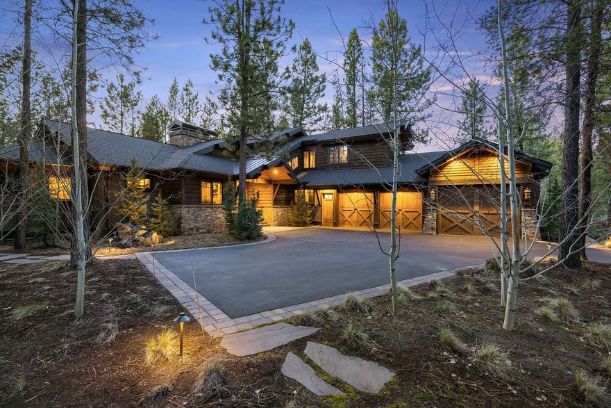 Unrivaled custom PacWest masterpiece in Caldera Springs, featured on the Tour of Homes. This home offers refined elegance impossible to replicate at this price. Step into a soaring great room warmed by a gas fireplace. The gourmet kitchen boasts premium stainless appliances and stone counters, perfect for entertaining. The luxurious main floor features a private Primary Suite, a Guest Ensuite, and a third bedroom transformed into a premium Office. Upstairs, the versatile fourth Bedroom serves as a fun bunk house. Entertainment abounds with a custom saloon, pool table, and a temperature-controlled wine room. Outside, discover a private sanctuary with stream views, cascading water features, a relaxing hot tub, and a built-in BBQ. A massive heated 3-car garage includes a loft and premium workspace. Complete with Sonos and smart home features. Enjoy exclusive community amenities: golf, pools, spa, and pickleball courts. Your ultimate Central Oregon sanctuary awaits!