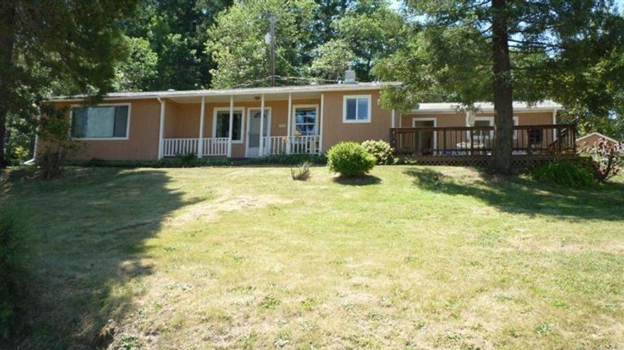 Make it your own! Well cared for home and property. One owner since 1964! Priced to allow for your own upgrades, this 3 bedroom 2 bath home on just shy of 1 acre (.96). Large enough for elbow room but not overwhelming to keep up. Wonderful views and sunsets to look forward to and is very close to the Applegate and Rogue River for fishing and recreation. Convenient location and less than 10 minutes to town. Nice sized small shop and well water to take care of your landscaping and garden.