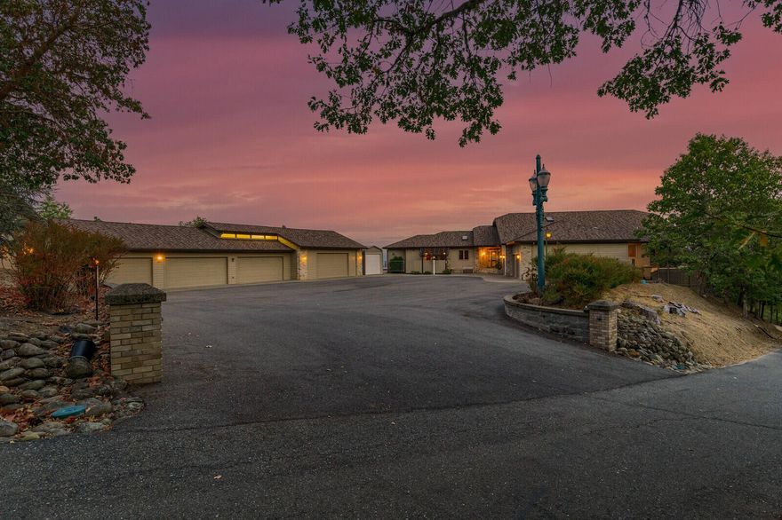 Gorgeous Custom View Home on 20+ acres with 2 shops!  The home was built to take in the expansive mountain & valley views & is perfect for entertaining, from the open floor plan, chef's kitchen & wet bar to the multi-level deck with hot tub in back!  The home boasts 3886 sq ft, 3 beds, 2 ½ baths & a custom office, an abundance of windows, skylites, built-ins throughout, custom ceiling & lighting details & gas fireplace.  Island kitchen features granite counter-tops, skylights, pantry cabinets & built-in desk. Luxurious master suite has access to back deck or private patio, 2 vanities, walk-in closet, garden tub & tile shower. Bed #2 doubles as a hobby room with built-in desk/counters, 2 closets & Jack & Jill bath to Bed #3.  Exterior features include 3 car attached garage, Shop #1 (2,092 sq ft) with 4 bays, heat pump & full bath, Shop #2 (1290 sq ft) has tall doors to accommodate 2 RVs! All buildings newly painted. Paved drive & gated entry & great internet complete this unique propert