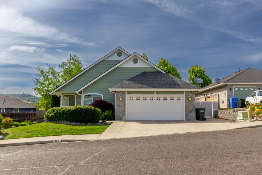 Backyard privacy in the middle of Eagle Point Subdivision.  This single level custom built home backs up to land planned to be a community park in the near future.  This open floor plan has a great room with vaulted ceilings, gas fireplace with a slate surround and ash hardwood floors.  The kitchen has granite counters, birchwood cabinets, stainless steel appliances and an abundance of counter space along with a long breakfast bar that opens to the great room.  The master suite skylights and slider to the backyard.  The master bath has double vanities, a tiled step-in shower and walk in closet.  The second bath has a jetted tub and quartz counters. Nice views off the backyard patio and the front deck of the mountains.  The roof was replaced in May 2022.  There is also side RV parking for all your toys.