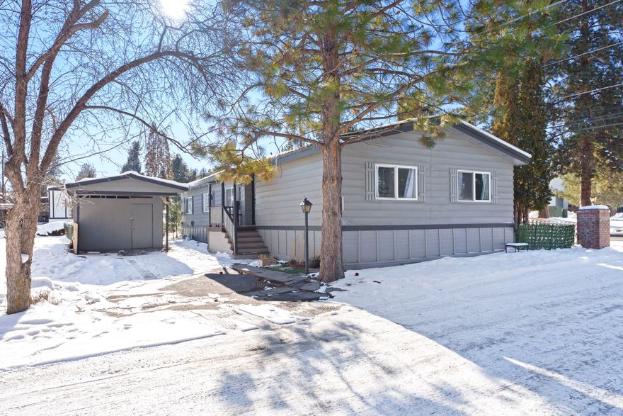 Step into luxury and comfort with this stunning 3-bedroom, 2-bathroom home featuring a desirable split
floor plan. Recently upgraded, it showcases a sleek, modern kitchen with stainless steel appliances.
You'll find new flooring throughout, a stylishly renovated guest bathroom, and a freshly remodeled
covered porch perfect for relaxing outdoors. With fresh interior and exterior paint and a newer
central heating system, every detail has been meticulously attended to.
Enjoy the convenience of ample storage shed space, a cozy wood-burning stove, and included washer and
dryer. Located just minutes from shopping and dining, this home offers both tranquility and
accessibility. Additional guest parking nearby adds to the convenience. Don't miss this one.  Land Lease to be $750 monthly per park manager.